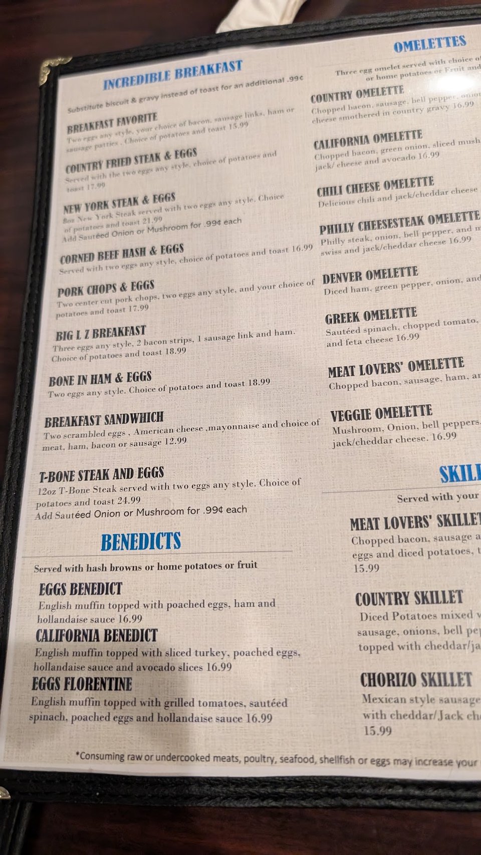 Cafe menu beside coffee and breakfast items.